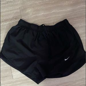 Nike solid black shorts size medium, im a small and they were very large on me.